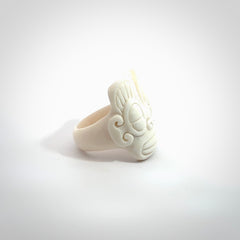 Hand carved natural bone tribal face ring. Natural bone ring with face design. Hand made ring, delivered with international airmail. Postage is included. Unique bone ring.