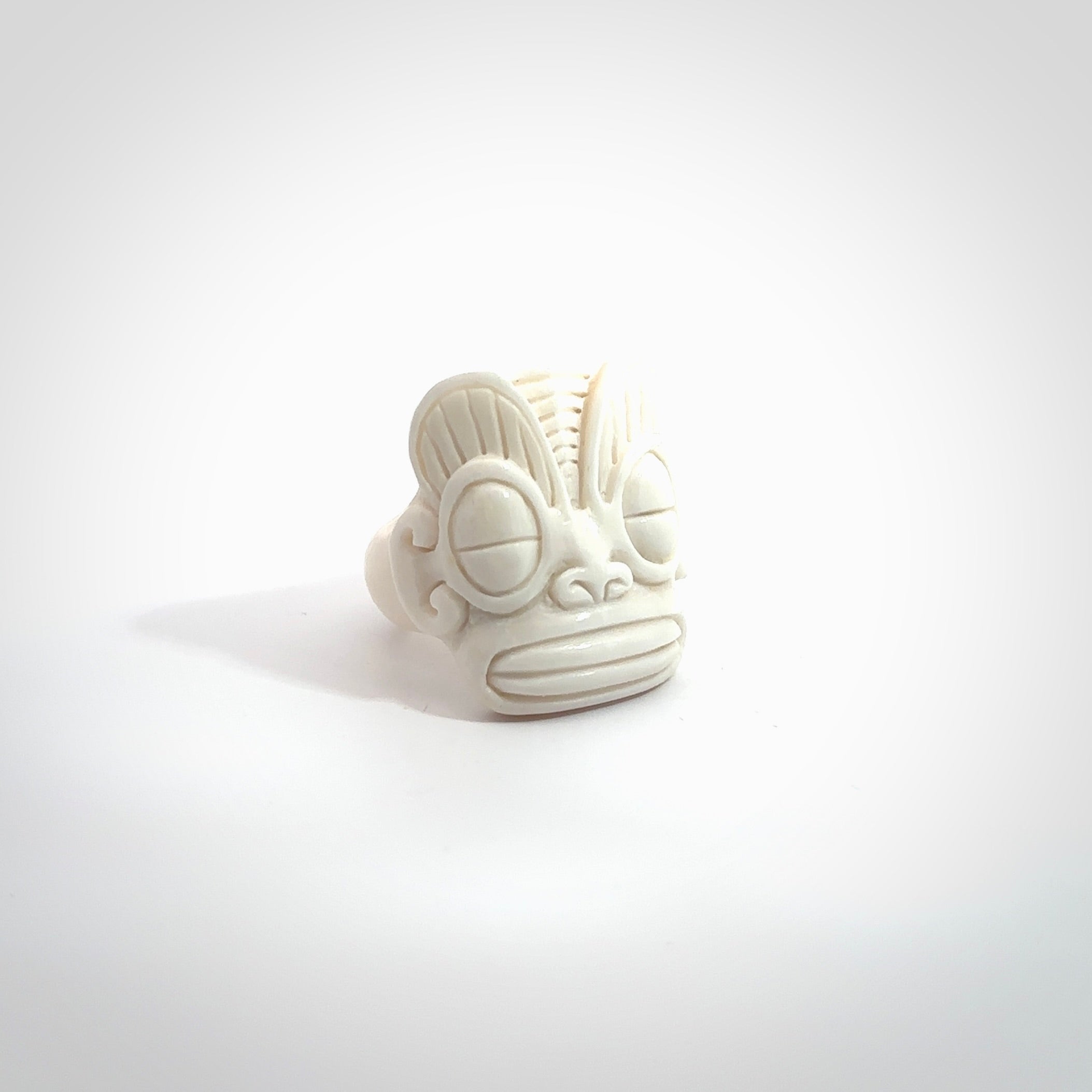 Hand carved natural bone tribal face ring. Natural bone ring with face design. Hand made ring, delivered with international airmail. Postage is included. Unique bone ring.