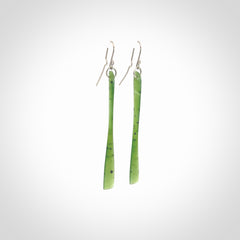 This picture shows hand carved New Zealand Jade, Pounamu paddle shaped, drop earrings. Delivery is free worldwide. NZ made Jade earrings. One pair only hand carved by New Zealand artist, Nicola Rees.