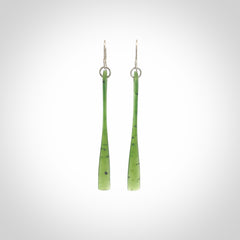 This picture shows hand carved New Zealand Jade, Pounamu paddle shaped, drop earrings. Delivery is free worldwide. NZ made Jade earrings. One pair only hand carved by New Zealand artist, Nicola Rees.