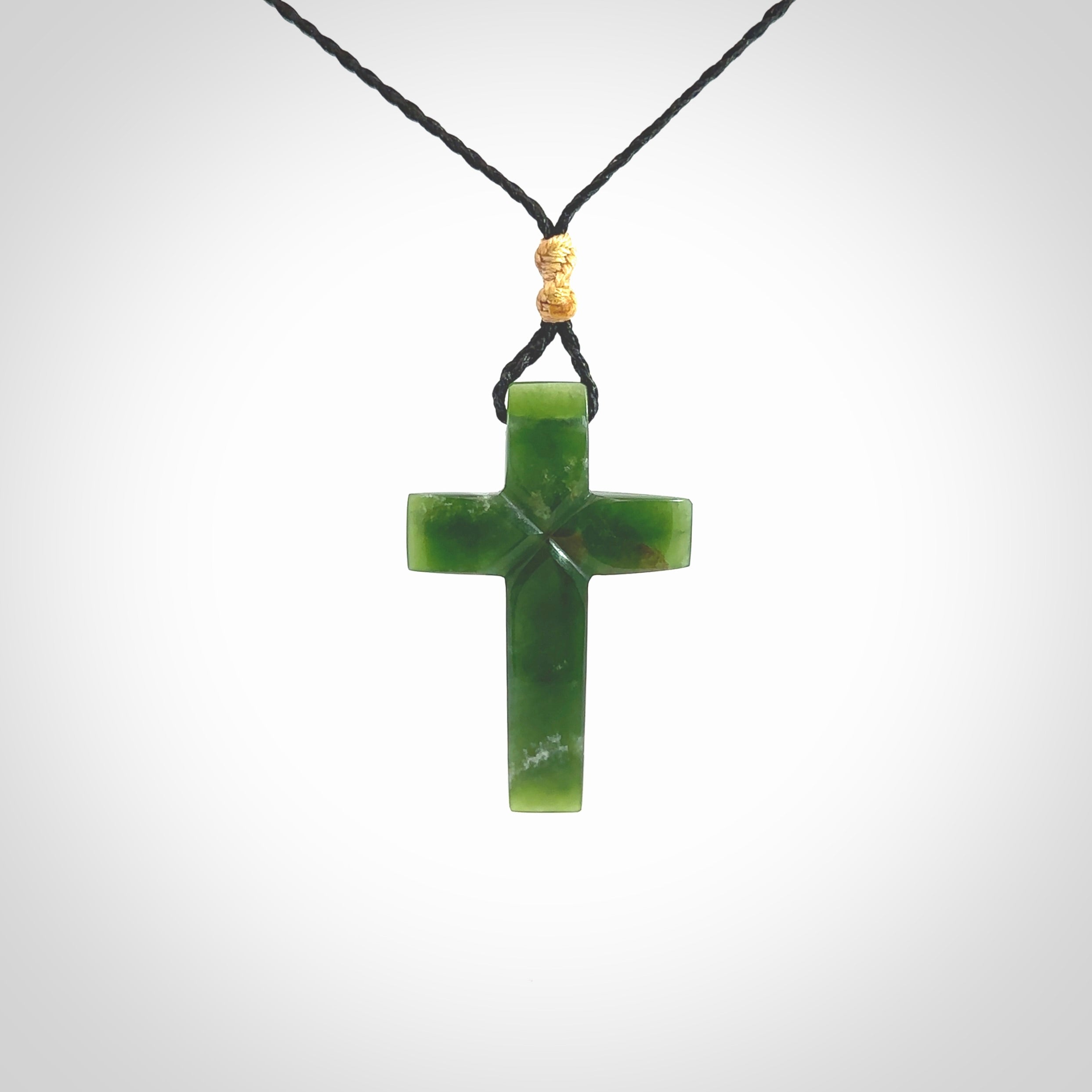 Hand carved New Zealand jade cross necklace. Religious symbol pendant. Christian cross pendant for sale online. Hand crafted from New Zealand Jade Pounamu, free worldwide delivery.