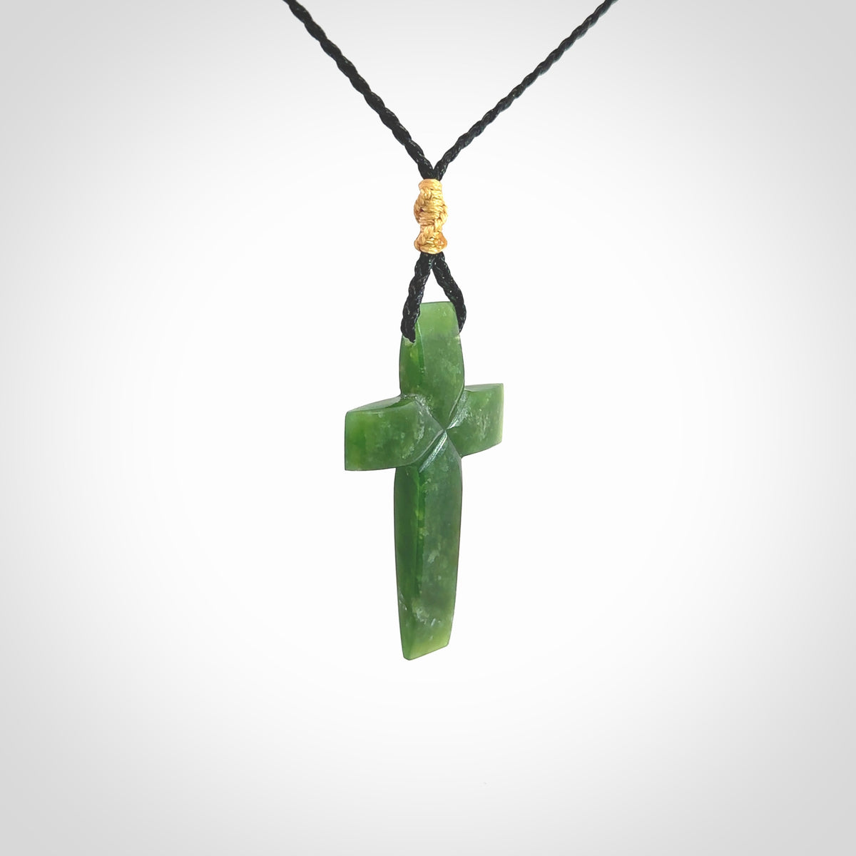 Hand carved New Zealand jade cross necklace. Religious symbol pendant. Christian cross pendant for sale online. Hand crafted from New Zealand Jade Pounamu, free worldwide delivery.