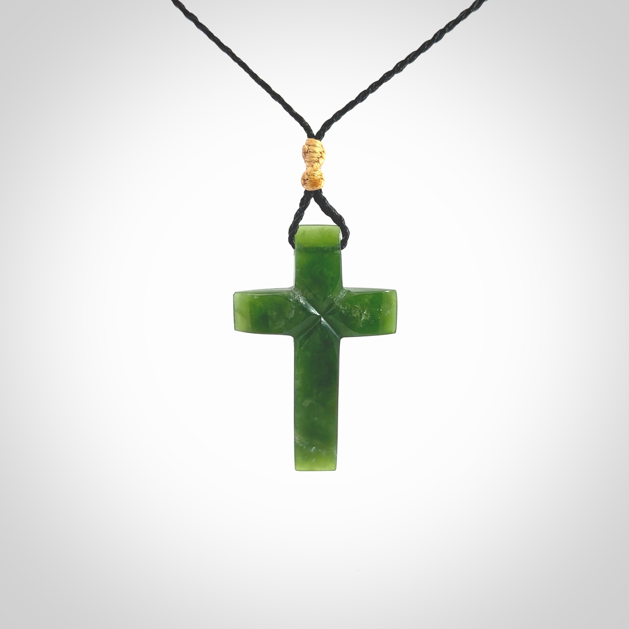 Hand carved New Zealand jade cross necklace. Religious symbol pendant. Christian cross pendant for sale online. Hand crafted from New Zealand Jade Pounamu, free worldwide delivery.