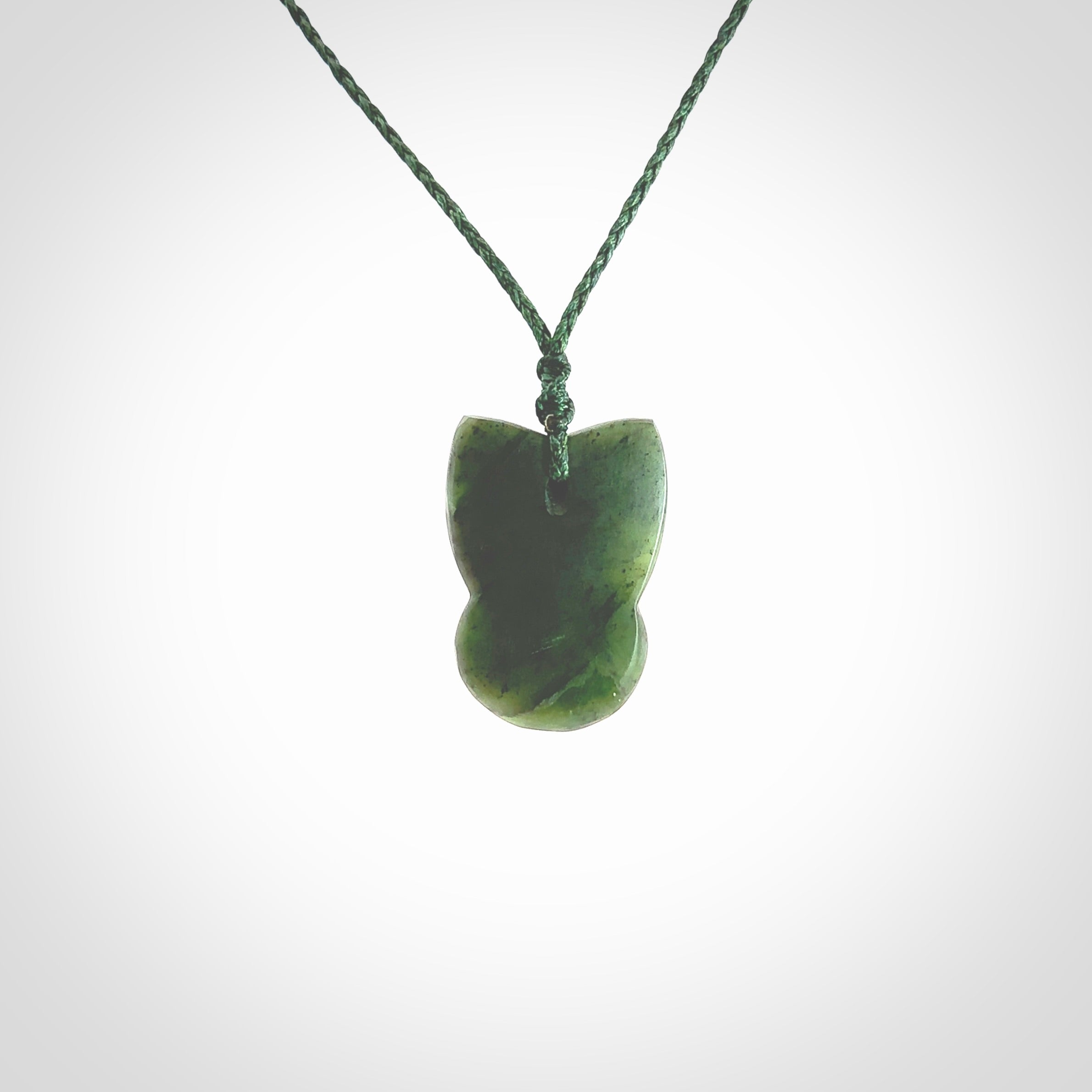 Hand carved New Zealand Jade Pounamu Wheku face pendant. Carved from New Zealand Jade by NZ Pacific. Hand crafted Jade jewellery for sale online. Pacific carving pendant, striking and unique delivered to you with Express Courier at no extra cost.