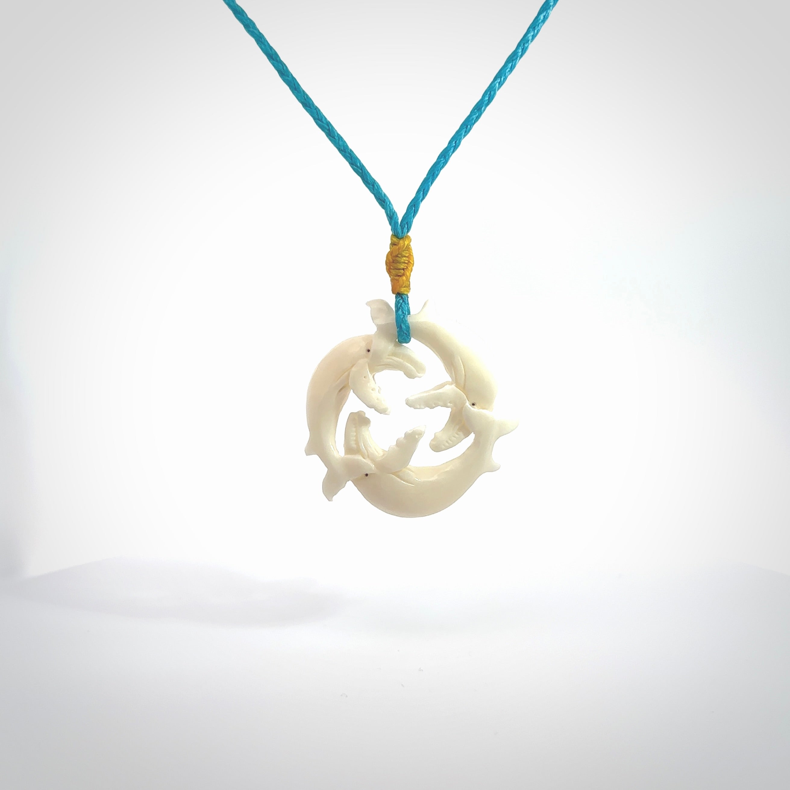 Hand carved natural bone whale trilogy pendant. Art to wear. Ocean themed pendants.