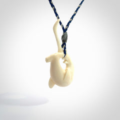 Hand carved hammerhead shark pendant. Carved in natural bone. Moana pendants for sale online.