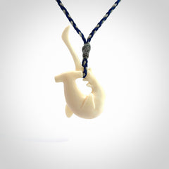 Hand carved hammerhead shark pendant. Carved in natural bone. Moana pendants for sale online.