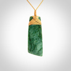 Hand carved from a lovely piece of local New Zealand Jade. The quality of the workmanship and design is outstanding - this is a piece you will want to wear all the time. We have suspended this from a 4-plait beige cord which can be adjusted with a couple of slip knots and beige binding. Hand made by Kyohei Noguchi.