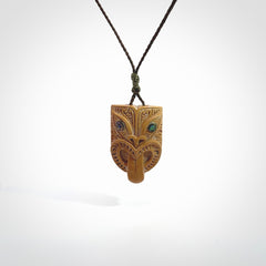 Hand carved Wheku pendant. Carved from woolly mammoth Tusk by NZ Pacific. Hand crafted Mammoth tusk jewellery for sale online. Provided with an adjustable cord and packaged in woven kete pouch