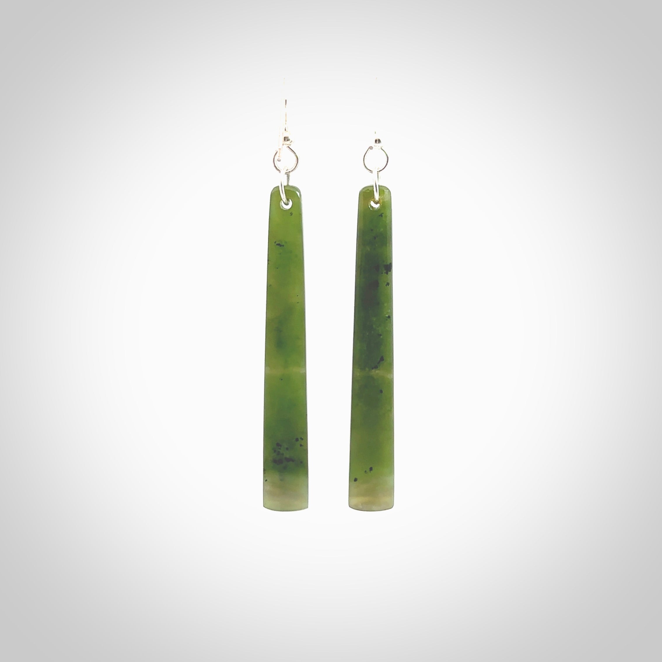 Hand carved New Zealand Jade drop earrings. Hand made drop earrings with sterling silver. Hand carved New Zealand Jade drop earrings by Rueben Tipene. Delivered in a woven kete pouch.