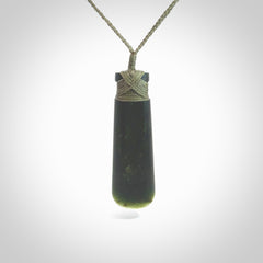 Hand made large New Zealand Kawakawa jade toki pendant. Hand carved in New Zealand by Rueben Tipene. Hand made jewellery. Unique large Jade Toki with adjustable cord. Free shipping worldwide.