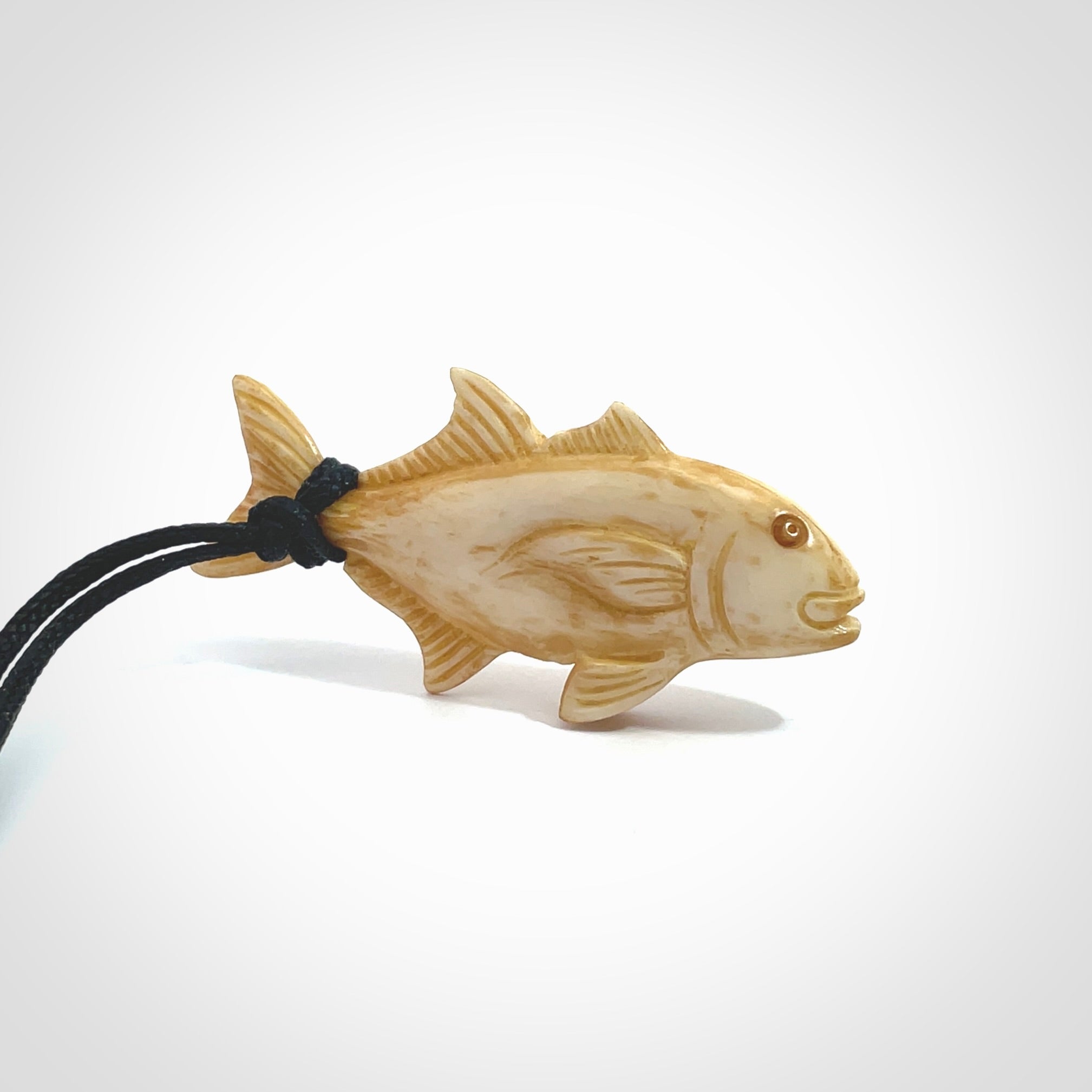 Hand carved stained bone fish pendant. Hand made stained bone fish necklace. Fish themed jewellery. Ocean themed pendant. Bone fish necklace provided with adjustable cord and free delivery.