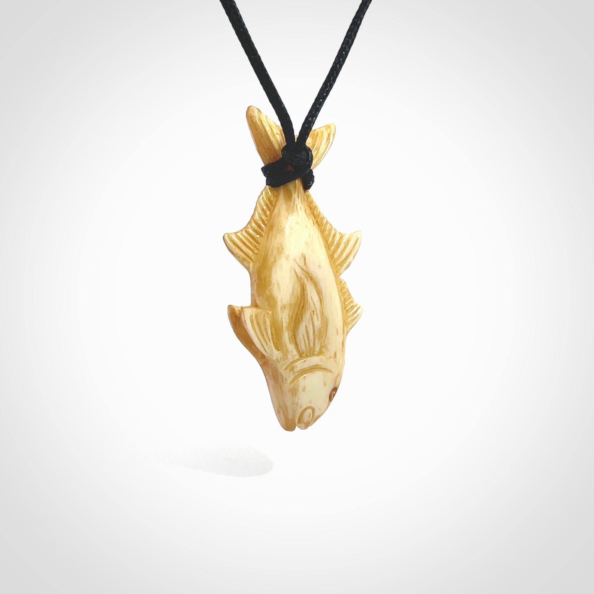 Hand carved stained bone fish pendant. Hand made stained bone fish necklace. Fish themed jewellery. Ocean themed pendant. Bone fish necklace provided with adjustable cord and free delivery.