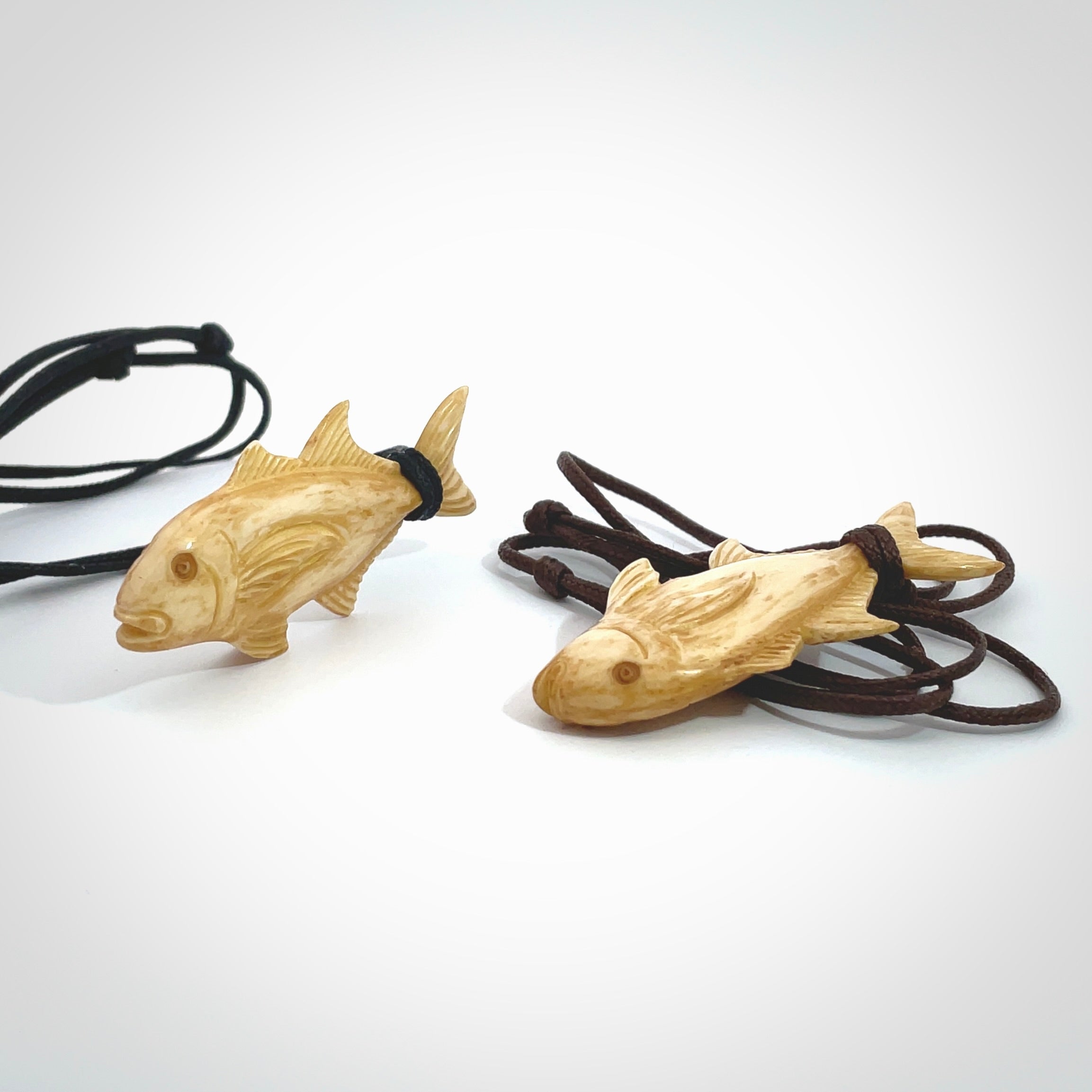 Hand carved stained bone fish pendant. Hand made stained bone fish necklace. Fish themed jewellery. Ocean themed pendant. Bone fish necklace provided with adjustable cord and free delivery.