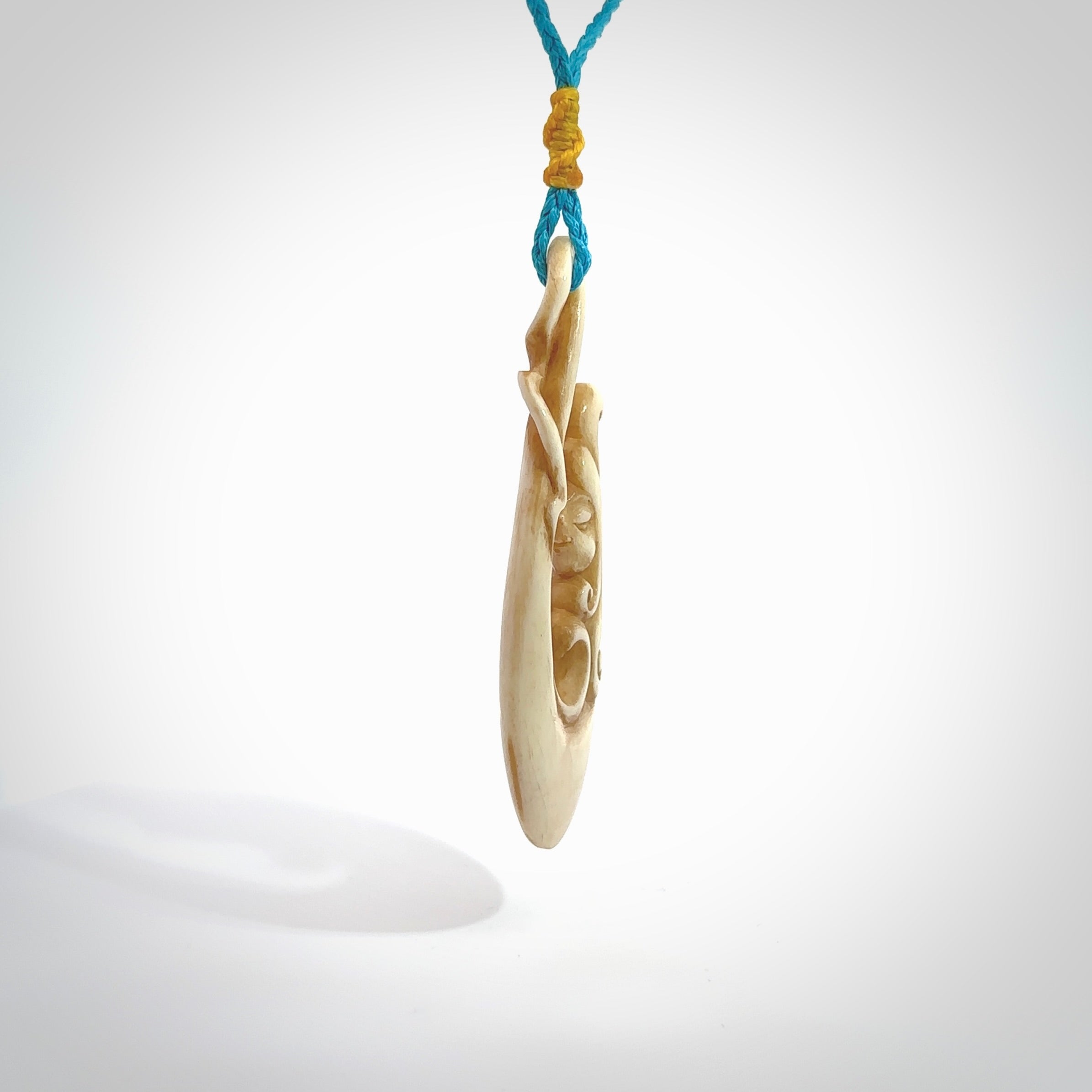 This pendant is a gorgeous and intricately carved mermaid hook pendant. Carved by renowned bone carver Yuri Terenyi for us. This is a masterpiece. It is a mermaid with her tail culminating into a hook. The craftsmanship displayed in this piece is extraordinary - a collectors item, or a piece to wear and love.