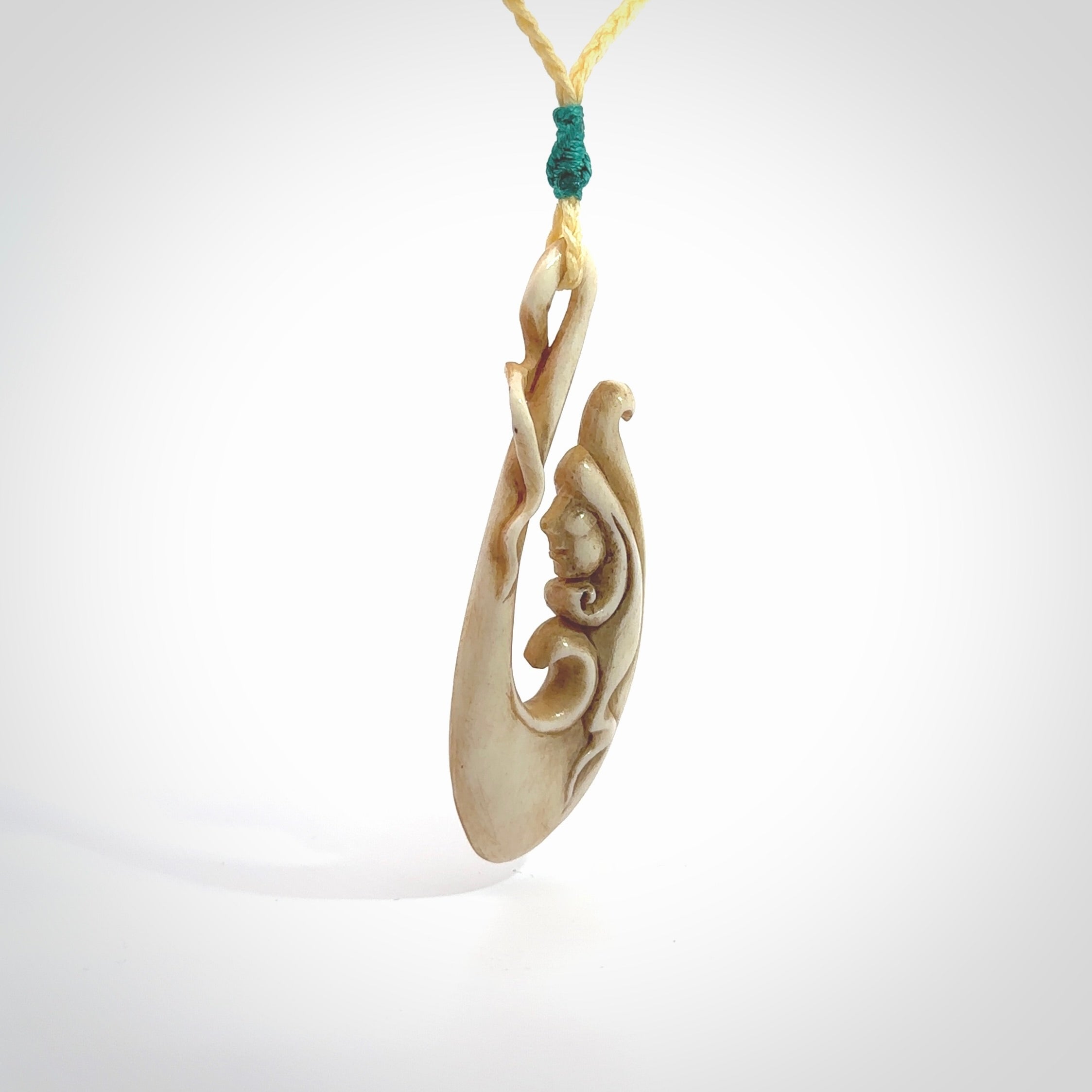 This pendant is a gorgeous and intricately carved mermaid hook pendant. Carved by renowned bone carver Yuri Terenyi for us. This is a masterpiece. It is a mermaid with her tail culminating into a hook. The craftsmanship displayed in this piece is extraordinary - a collectors item, or a piece to wear and love.