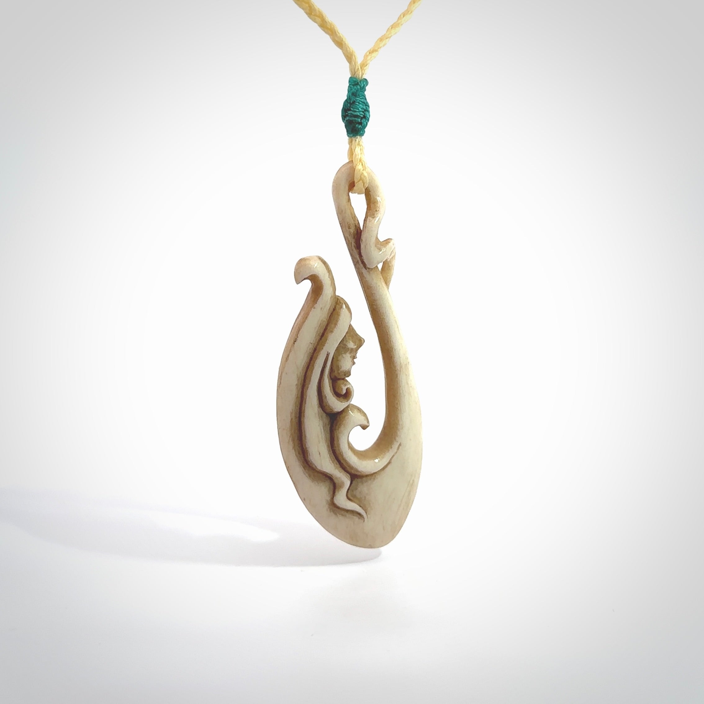 This pendant is a gorgeous and intricately carved mermaid hook pendant. Carved by renowned bone carver Yuri Terenyi for us. This is a masterpiece. It is a mermaid with her tail culminating into a hook. The craftsmanship displayed in this piece is extraordinary - a collectors item, or a piece to wear and love.