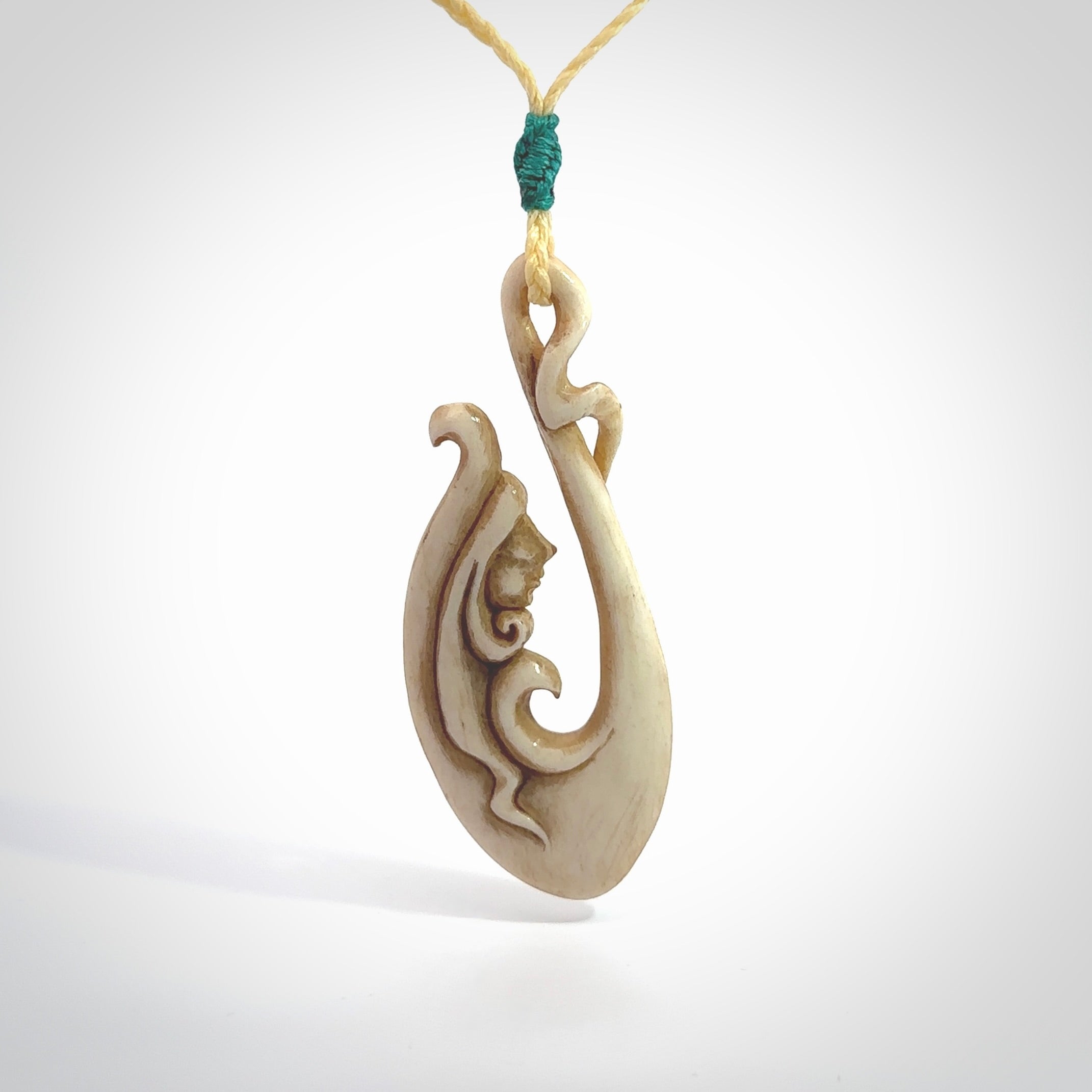 This pendant is a gorgeous and intricately carved mermaid hook pendant. Carved by renowned bone carver Yuri Terenyi for us. This is a masterpiece. It is a mermaid with her tail culminating into a hook. The craftsmanship displayed in this piece is extraordinary - a collectors item, or a piece to wear and love.