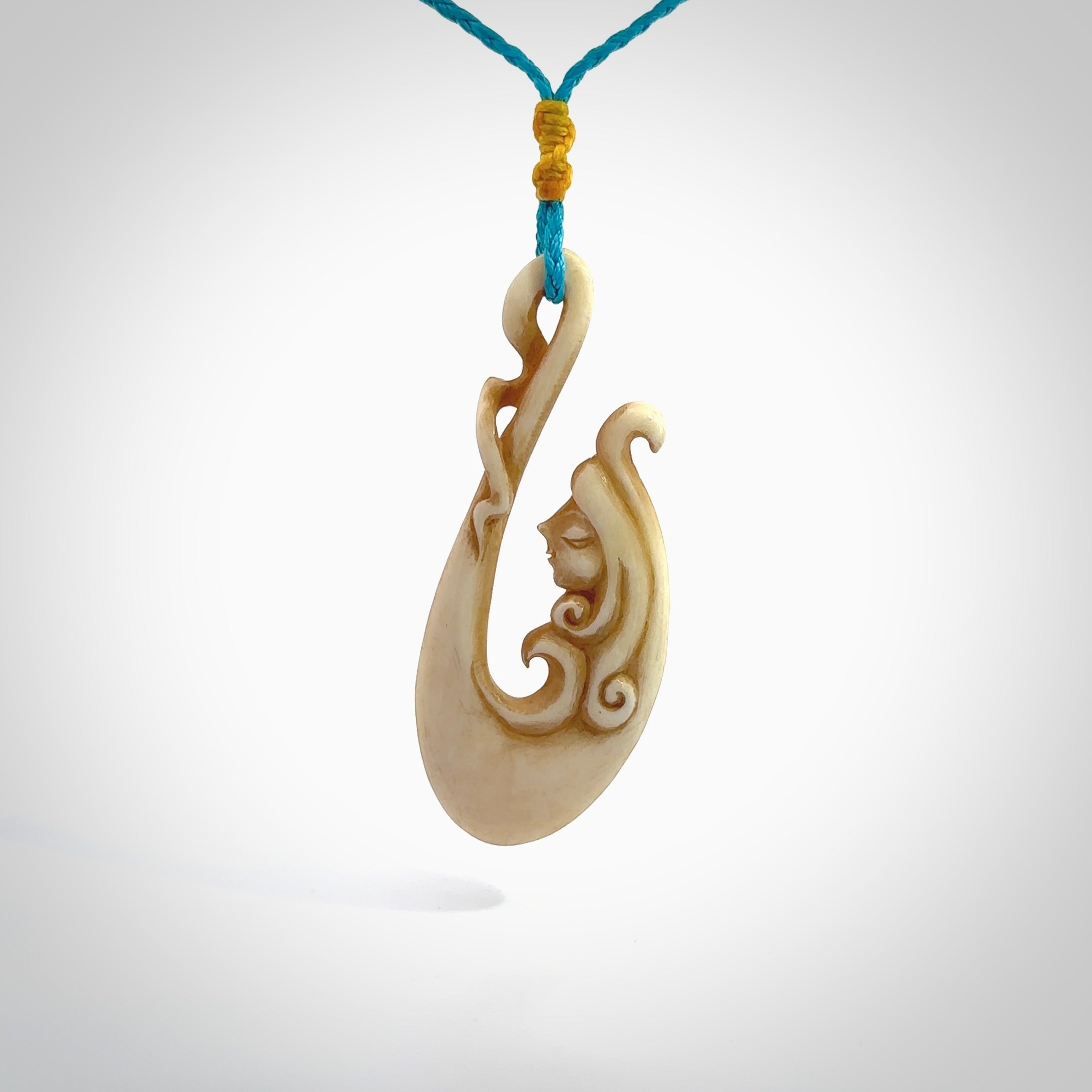 This pendant is a gorgeous and intricately carved mermaid hook pendant. Carved by renowned bone carver Yuri Terenyi for us. This is a masterpiece. It is a mermaid with her tail culminating into a hook. The craftsmanship displayed in this piece is extraordinary - a collectors item, or a piece to wear and love.