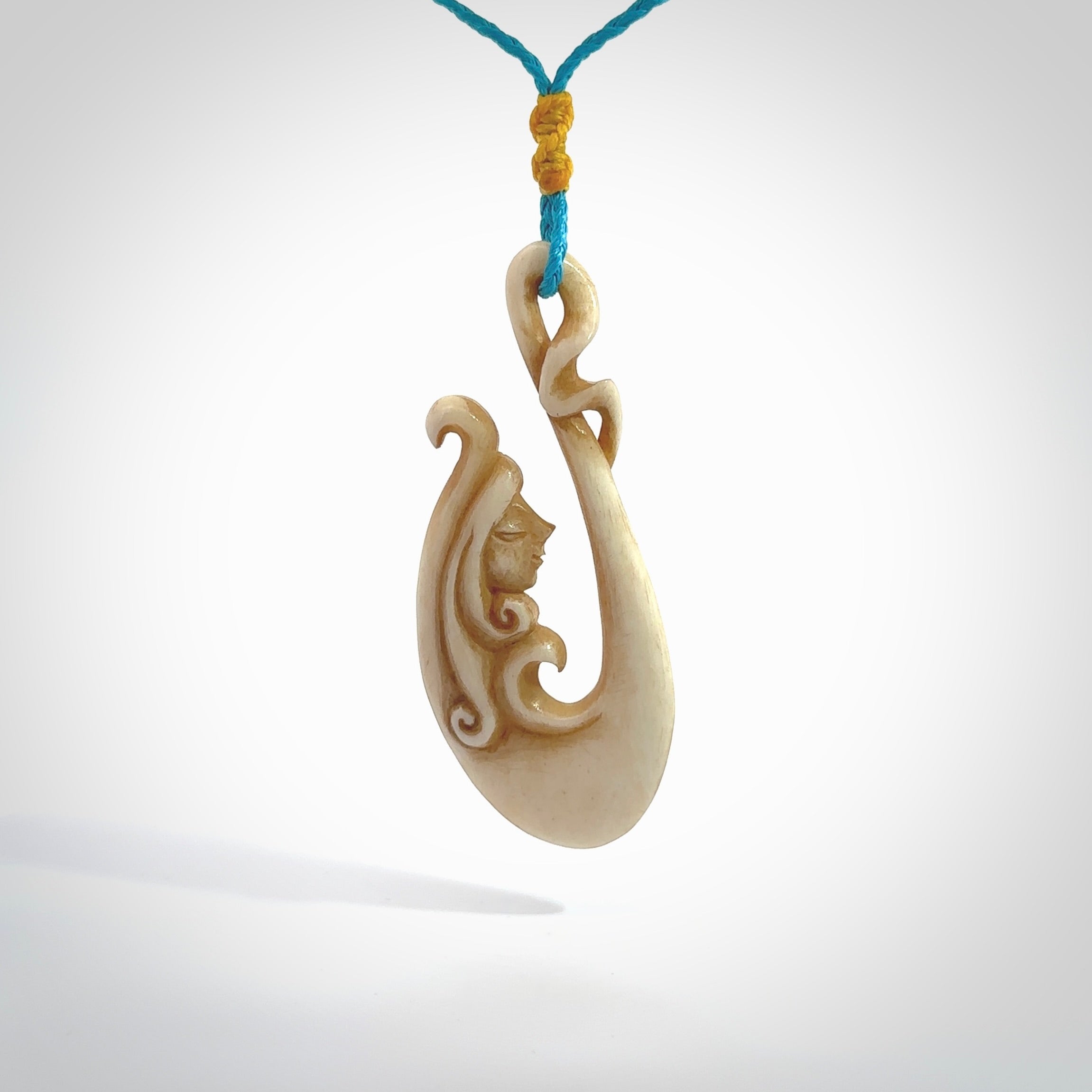 This pendant is a gorgeous and intricately carved mermaid hook pendant. Carved by renowned bone carver Yuri Terenyi for us. This is a masterpiece. It is a mermaid with her tail culminating into a hook. The craftsmanship displayed in this piece is extraordinary - a collectors item, or a piece to wear and love.