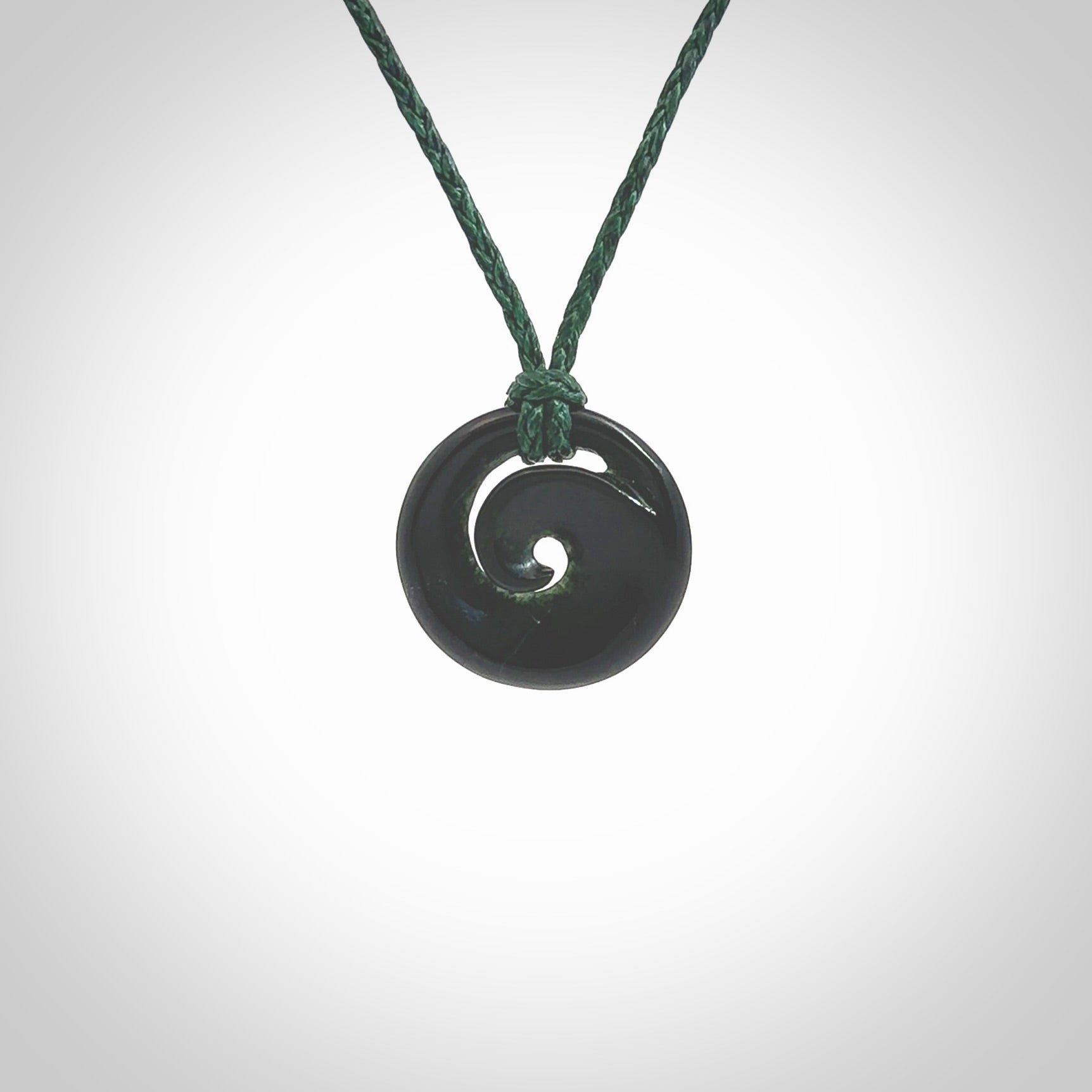 This little pendant is a beautifully carved, small jade koru pendant. Hand Carved for NZ Pacific by Graeme Wylie. Jade jewelry for sale online exclusively with NZ Pacific.