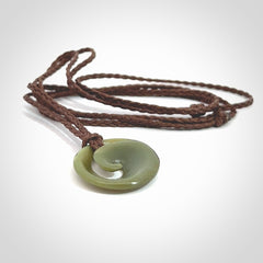 This little pendant is a beautifully carved, small jade koru pendant. Hand Carved for NZ Pacific by Graeme Wylie. Jade jewelry for sale online exclusively with NZ Pacific.