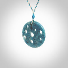 This is a handcrafted aotea stone disc pendant. This is a solid contemporary work of art. We ship this worldwide express courier and are happy to answer any questions that you may have about these or other products on our website. Hand made by Ana Krakosky.