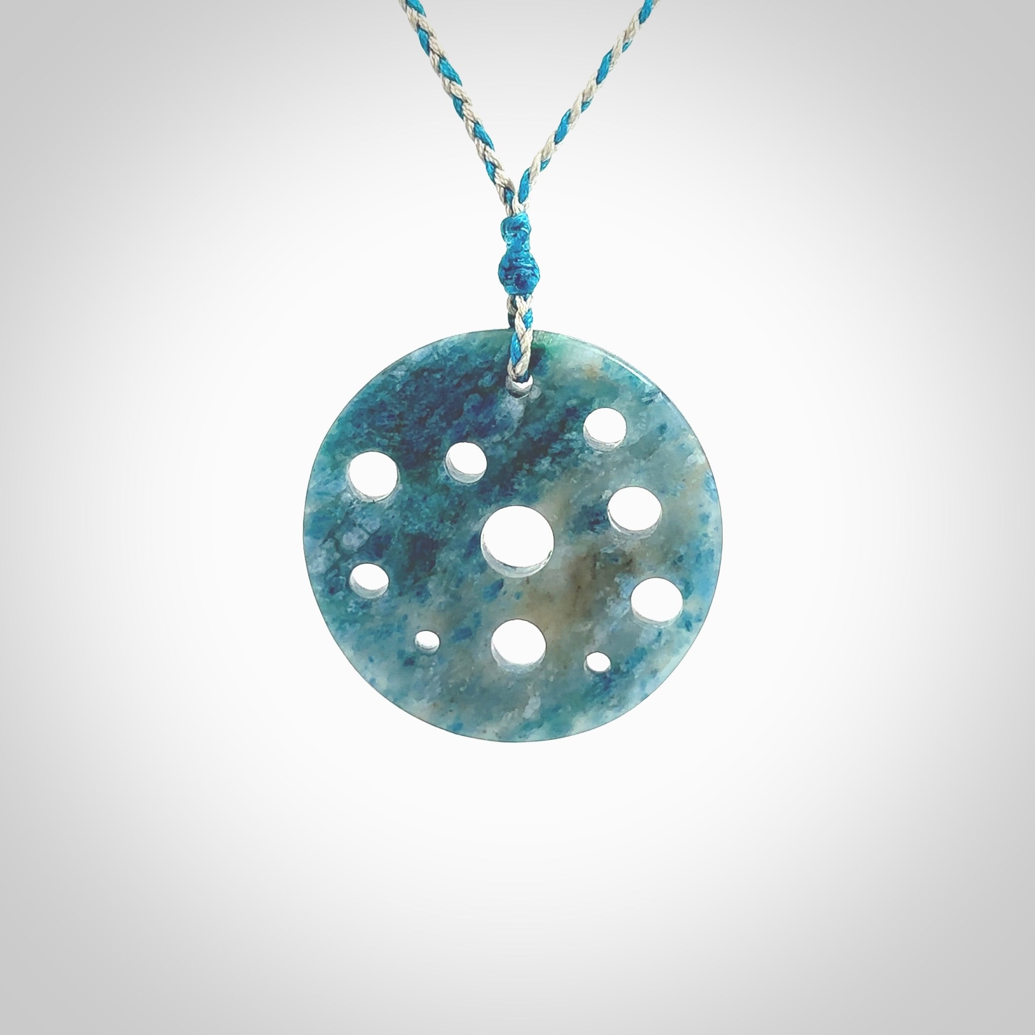 This is a handcrafted aotea stone disc pendant. This is a solid contemporary work of art. We ship this worldwide express courier and are happy to answer any questions that you may have about these or other products on our website. Hand made by Ana Krakosky.