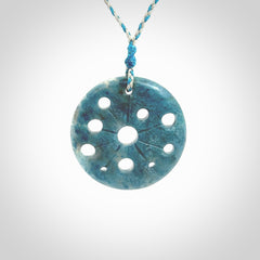 This is a handcrafted aotea stone disc pendant. This is a solid contemporary work of art. We ship this worldwide express courier and are happy to answer any questions that you may have about these or other products on our website. Hand made by Ana Krakosky.