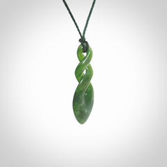 Hand carved New Zealand jade twist pendant. Carved in New Zealand by NZ Pacific. Unique double twist jewellery for sale online. Provided with an adjustable Manuka Green cord.