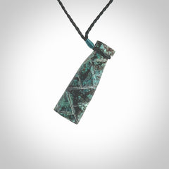 This is a hand carved drop pendant made from a gorgeous and striking piece of African Turquoise stone. For sale online from NZ Pacific. Delivered with adjustable black cord.