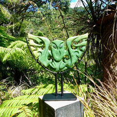 A hand carved New Zealand Jade owl sculpture with Paua shell eyes. A large sized hand made ruru, owl, sculpture by New Zealand artist Kerry Thompson. One off work of art to display.