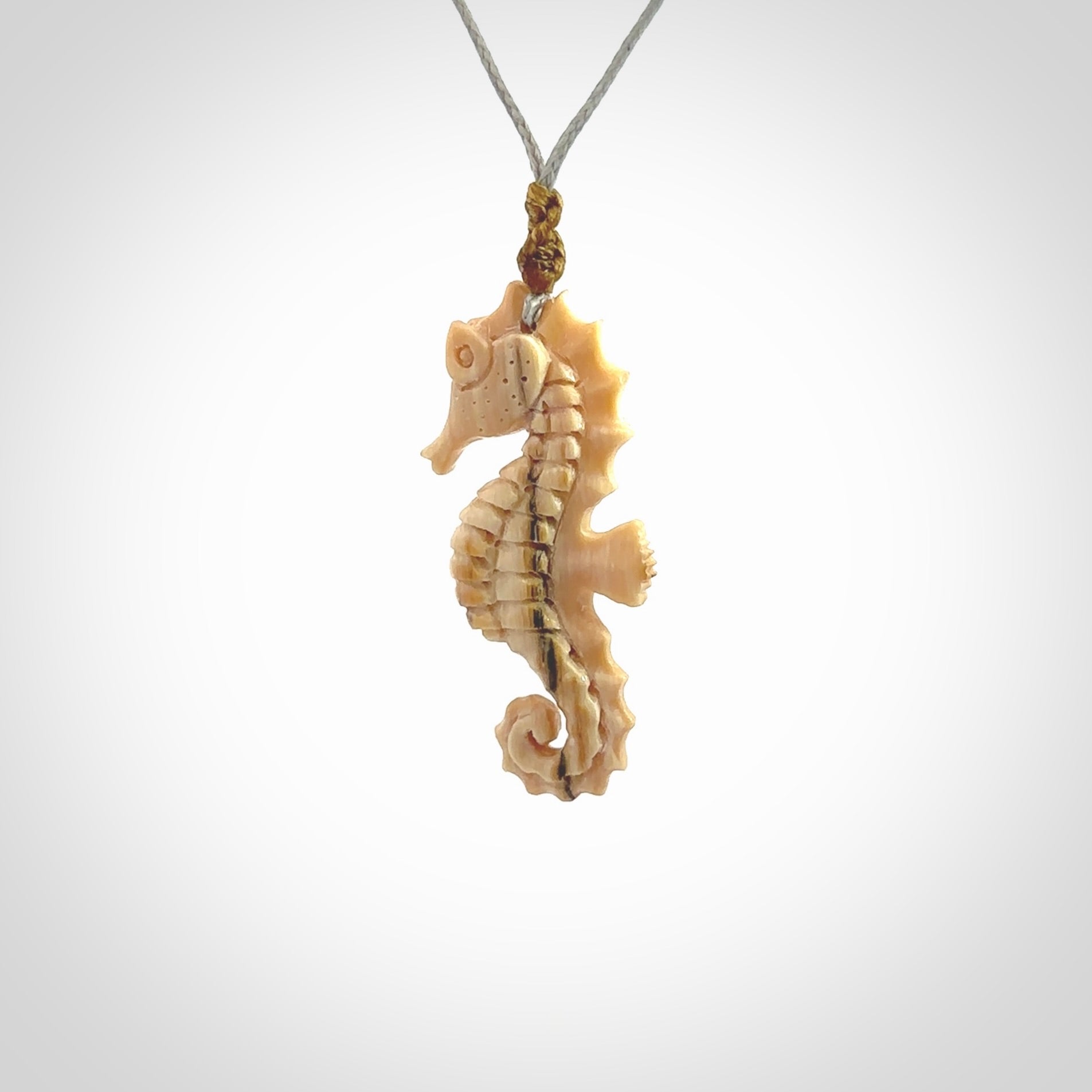 This little pendant is a beautifully carved seahorse pendant made from ancient woolly mammoth tusk. We have designed this so that it can be worn as a pendant, or as a little charm. Made by NZ Pacific and for sale worldwide on our website. Free Postage wherever you are.