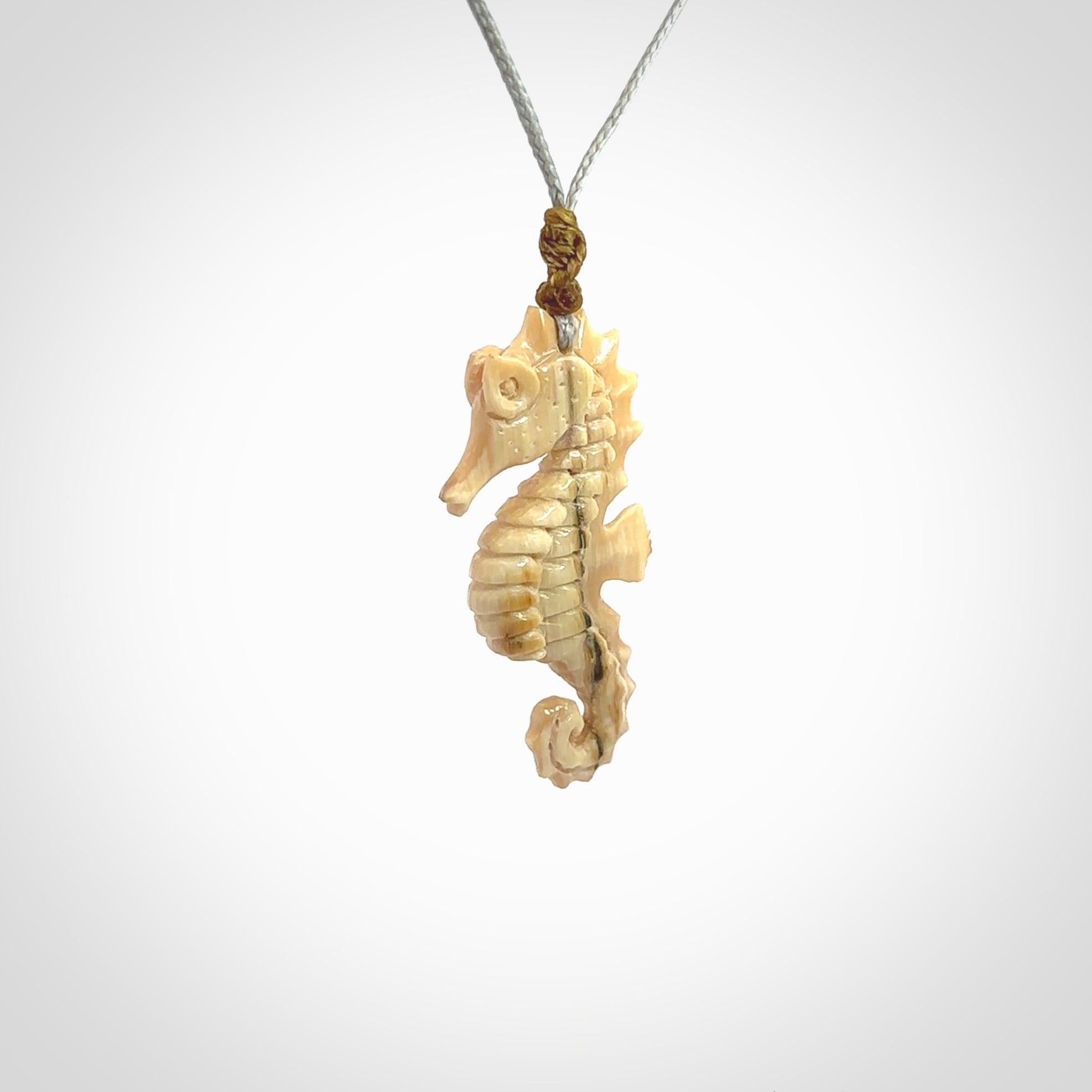 This little pendant is a beautifully carved seahorse pendant made from ancient woolly mammoth tusk. We have designed this so that it can be worn as a pendant, or as a little charm. Made by NZ Pacific and for sale worldwide on our website. Free Postage wherever you are.