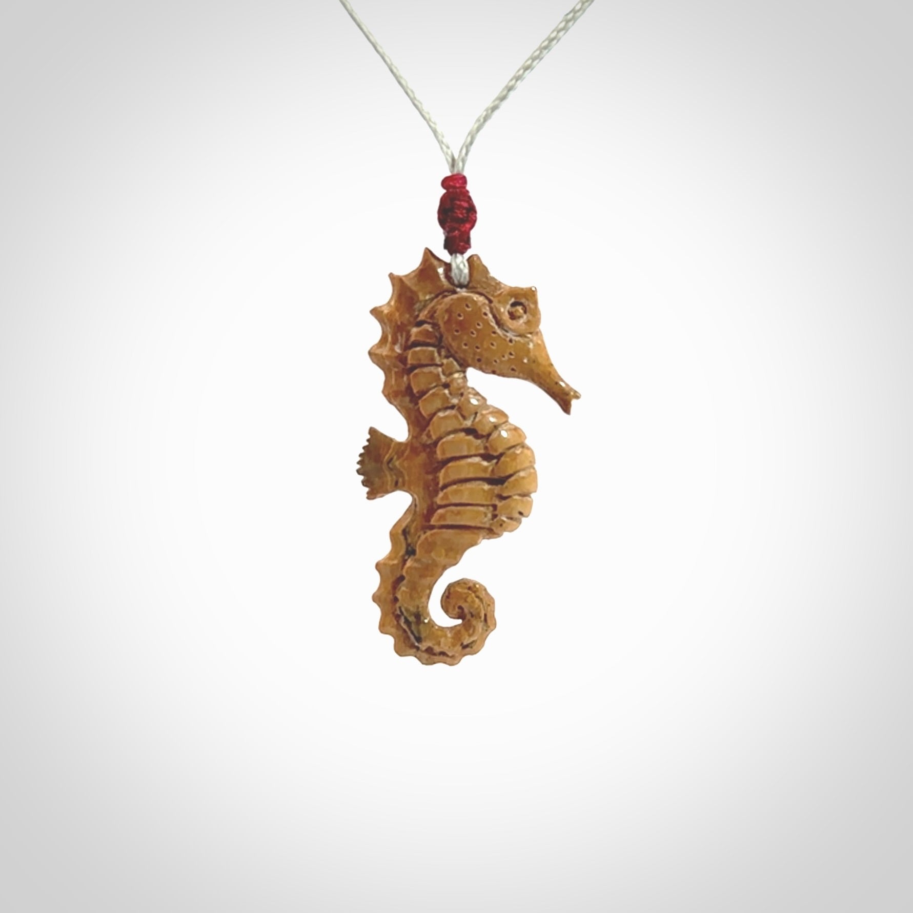 This little pendant is a beautifully carved seahorse pendant made from ancient woolly mammoth tusk. We have designed this so that it can be worn as a pendant, or as a little charm. Made by NZ Pacific and for sale worldwide on our website. Free Postage wherever you are.