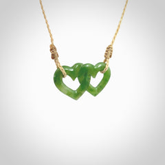 Hand carved double heart pendant made in green jade stone. Made by NZ Pacific. Carved from green jade. Free delivery worldwide.