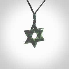 Hand carved New Zealand Tangiwai Pounamu small Magen David necklace. Unique and creative art to wear from New Zealand Tangiwai Pounamu hand made by New Zealand artist Graeme Wylie. Magen David pendant for men and women.