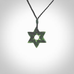 Hand carved New Zealand Tangiwai Pounamu small Magen David necklace. Unique and creative art to wear from New Zealand Tangiwai Pounamu hand made by New Zealand artist Graeme Wylie. Magen David pendant for men and women.