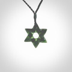 Hand carved New Zealand Tangiwai Pounamu small Magen David necklace. Unique and creative art to wear from New Zealand Tangiwai Pounamu hand made by New Zealand artist Graeme Wylie. Magen David pendant for men and women.