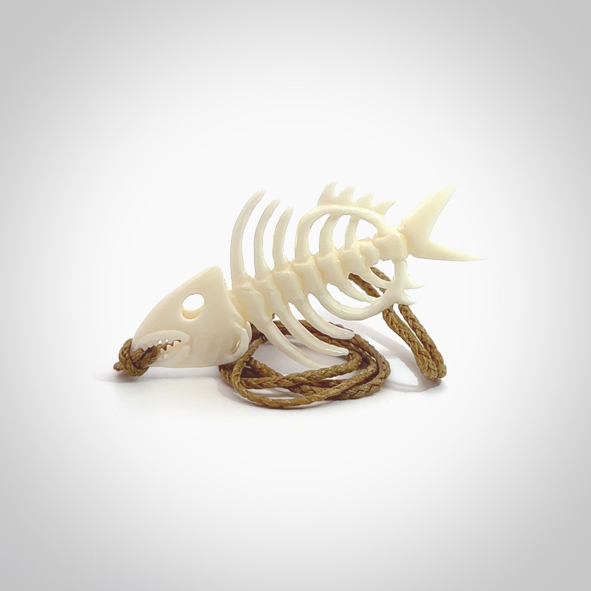 Hand carved bone fish skeleton pendant. Hand made bone fish necklace. Fish themed jewellery. Ocean themed pendant. One only necklace provided with adjustable cord and free delivery.