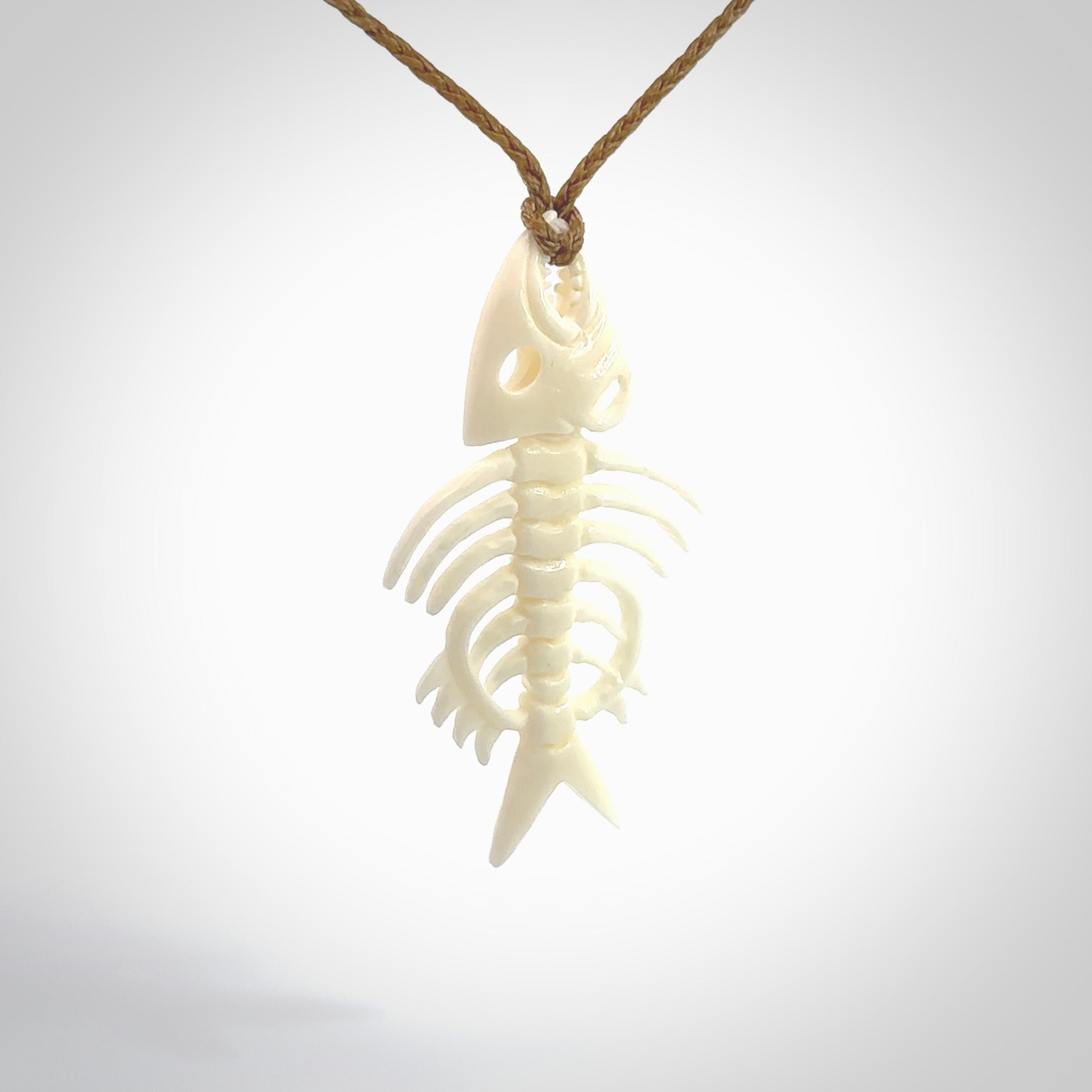 Hand carved bone fish skeleton pendant. Hand made bone fish necklace. Fish themed jewellery. Ocean themed pendant. One only necklace provided with adjustable cord and free delivery.