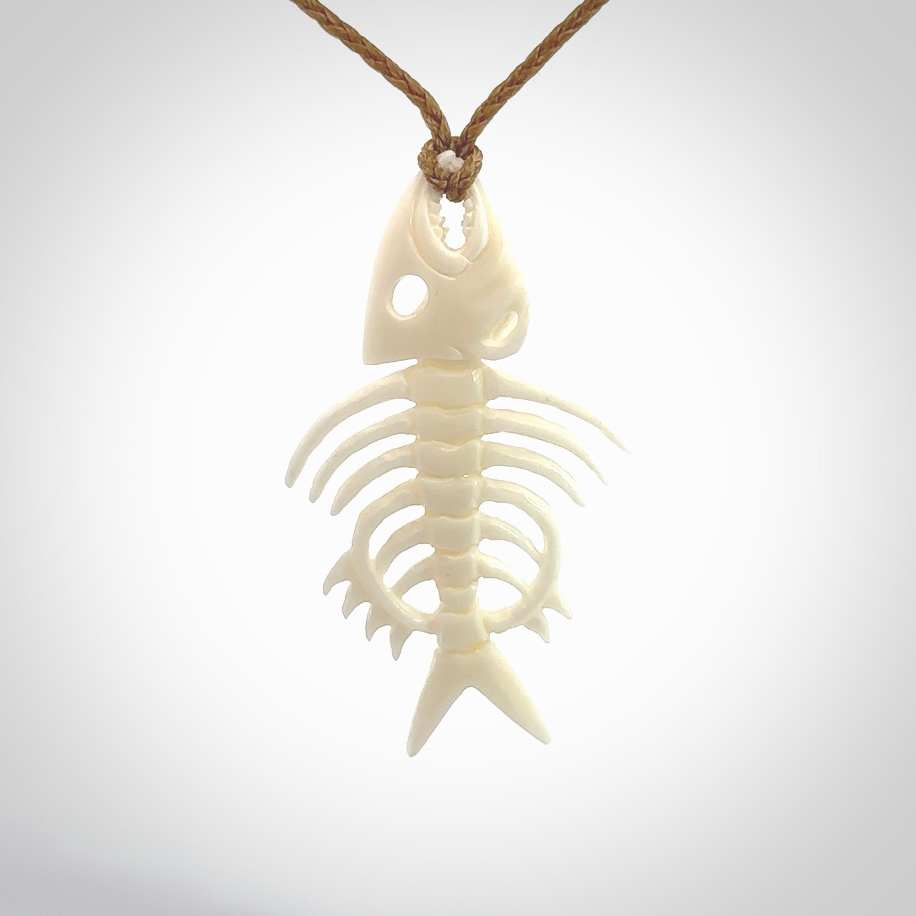 Hand carved bone fish skeleton pendant. Hand made bone fish necklace. Fish themed jewellery. Ocean themed pendant. One only necklace provided with adjustable cord and free delivery.