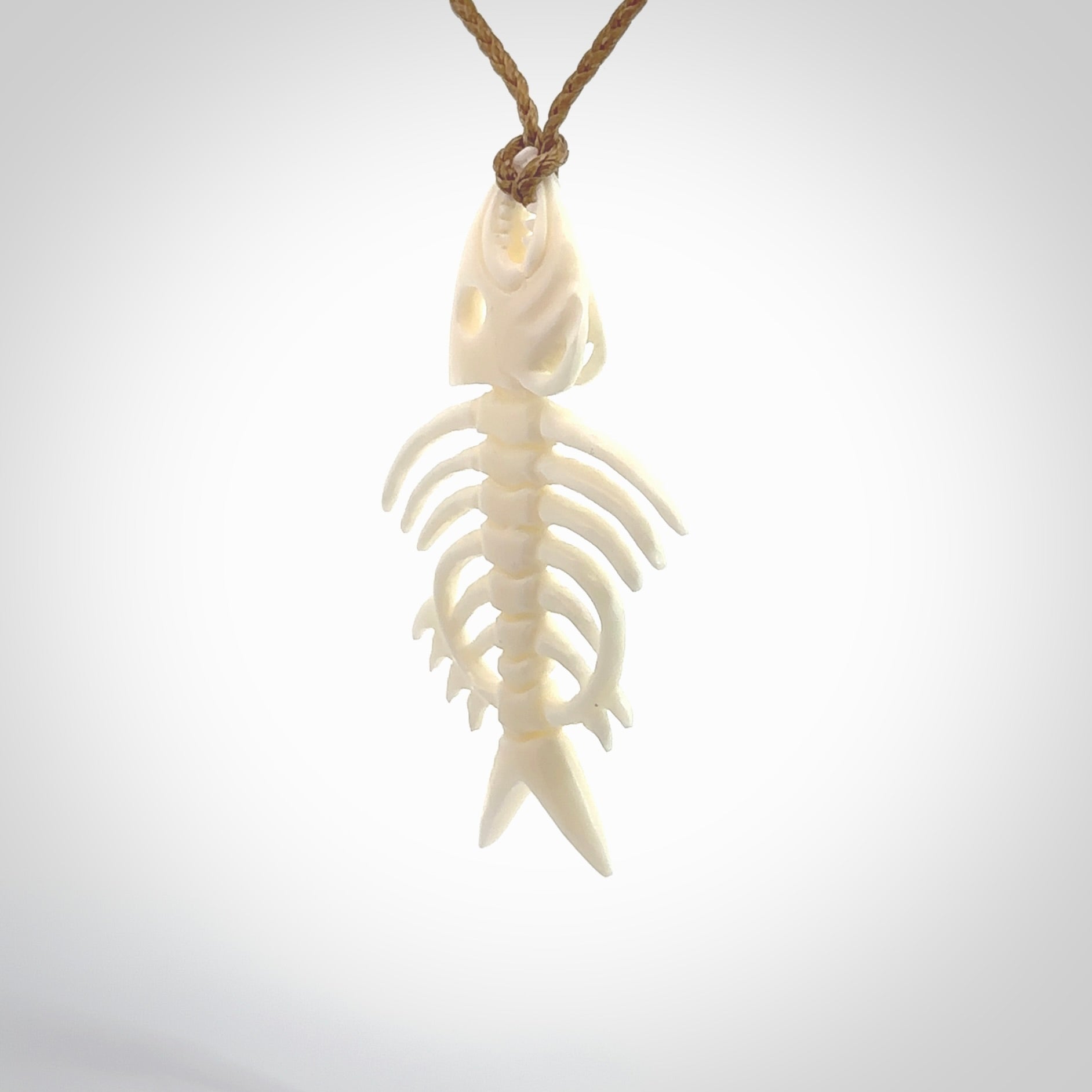 Hand carved bone fish skeleton pendant. Hand made bone fish necklace. Fish themed jewellery. Ocean themed pendant. One only necklace provided with adjustable cord and free delivery.