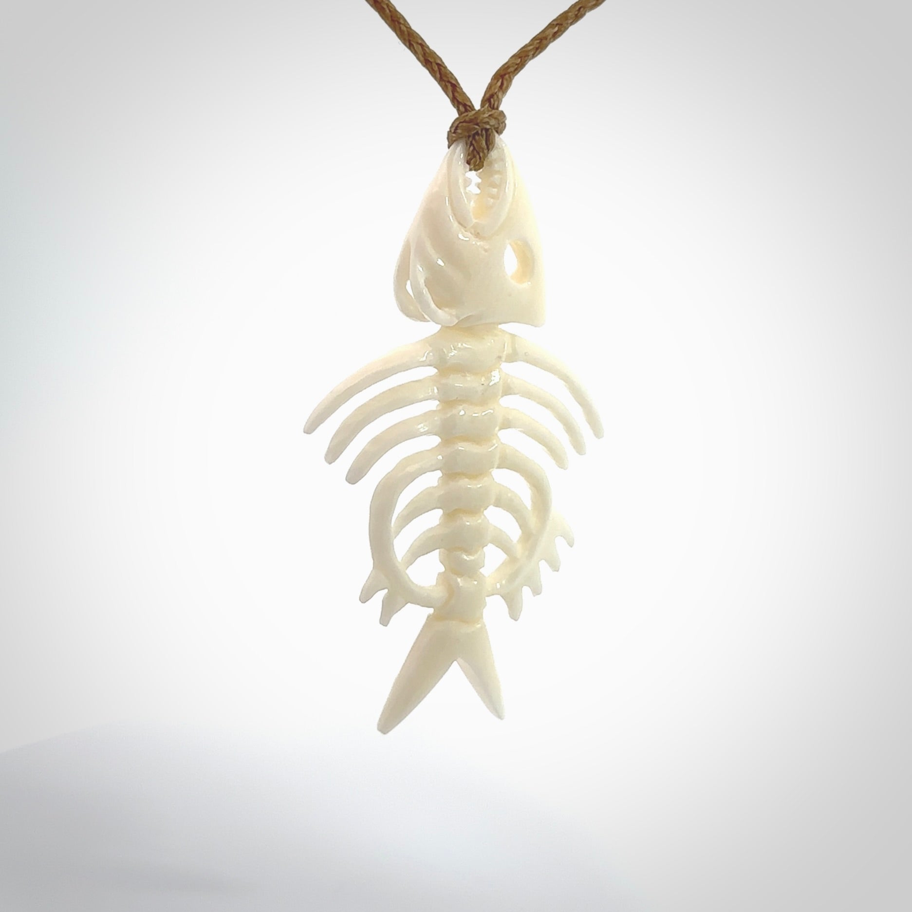 Hand carved bone fish skeleton pendant. Hand made bone fish necklace. Fish themed jewellery. Ocean themed pendant. One only necklace provided with adjustable cord and free delivery.