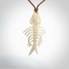 Hand carved bone fish skeleton pendant. Hand made bone fish necklace. Fish themed jewellery. Ocean themed pendant. One only necklace provided with adjustable cord and free delivery.