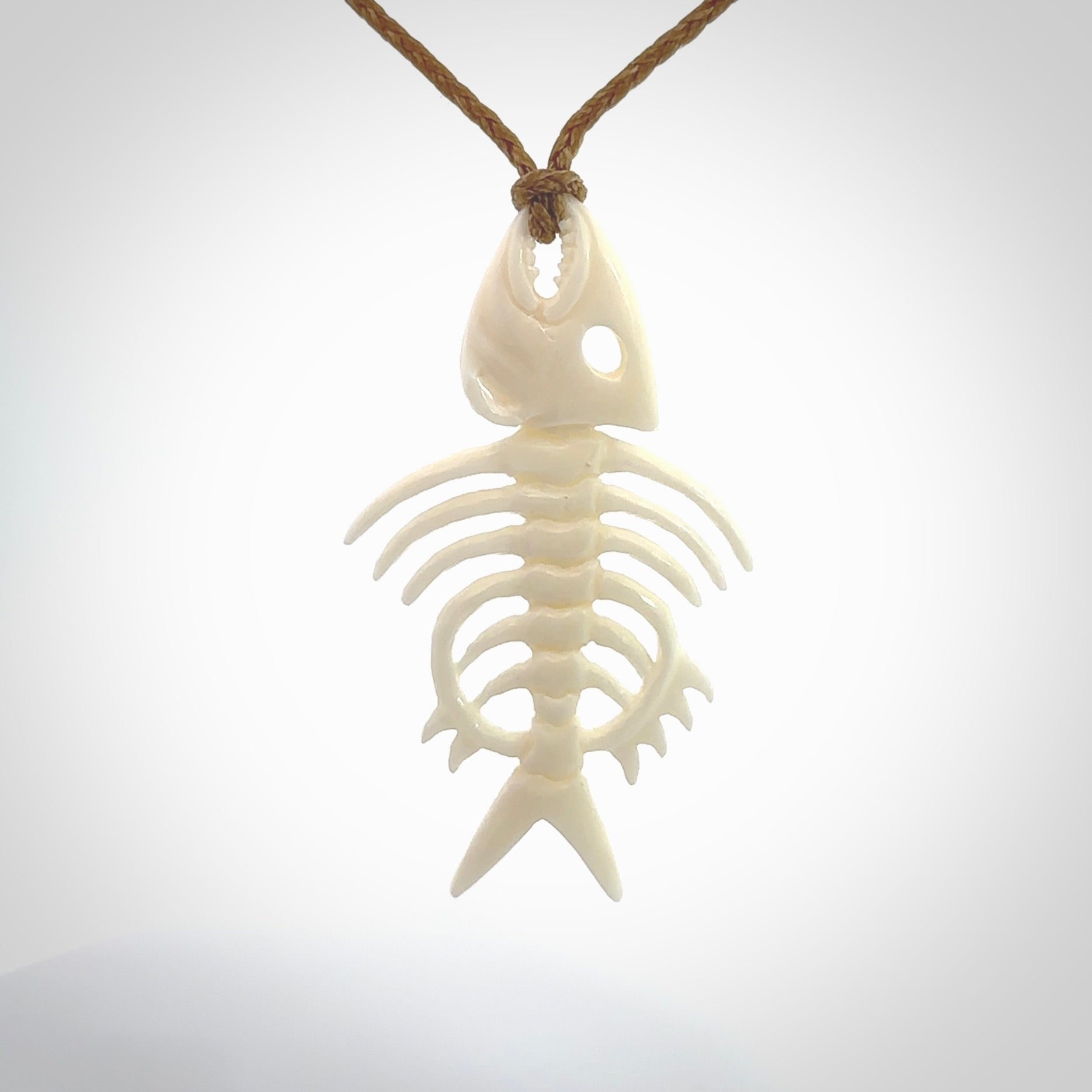 Hand carved bone fish skeleton pendant. Hand made bone fish necklace. Fish themed jewellery. Ocean themed pendant. One only necklace provided with adjustable cord and free delivery.