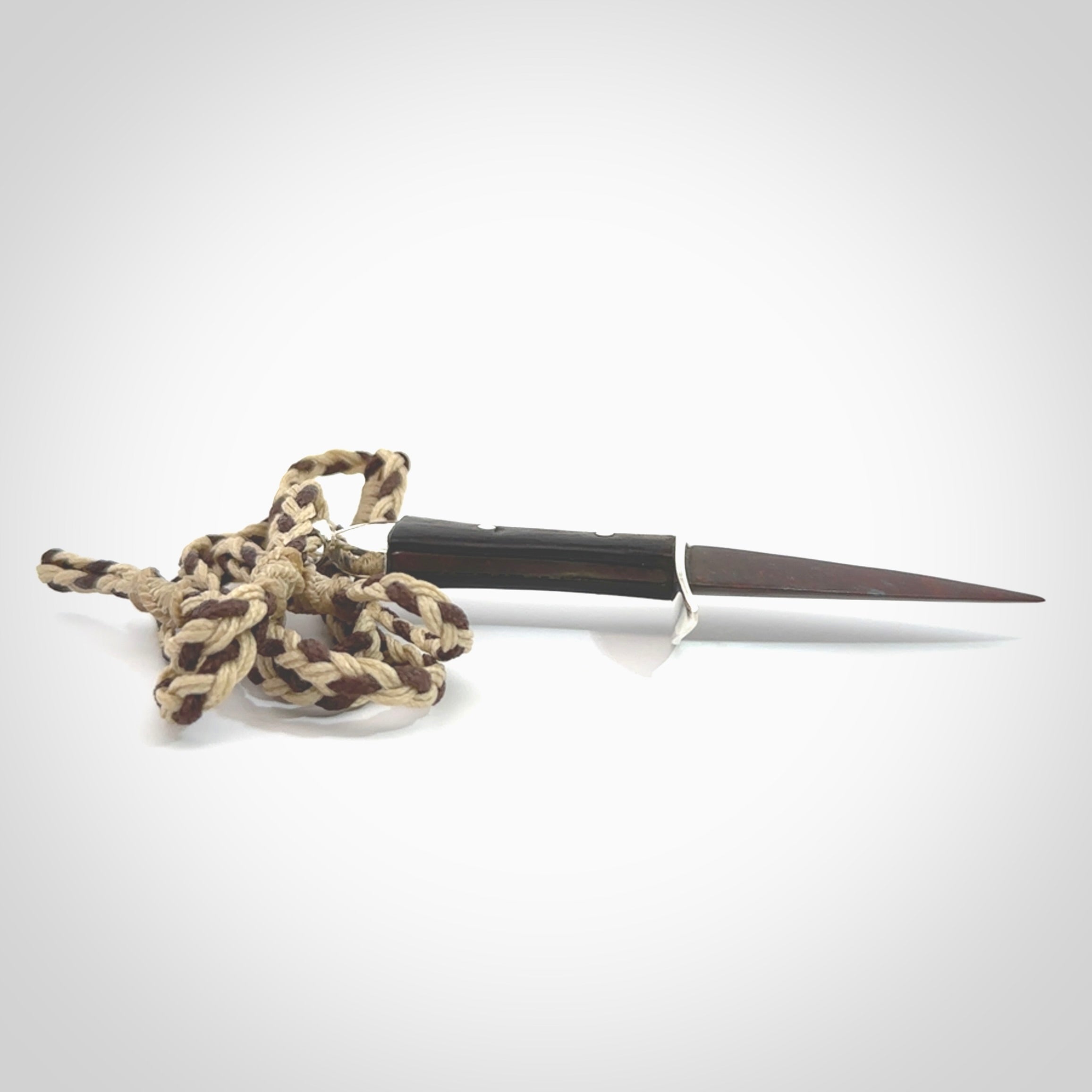 A striking hand carved knife pendant. These are carved with a Red Jasper Stone head and a hardwood handle. The cords are hand plaited in our waxed polyester which is robust, strong and durable. We ship these worldwide with express courier.