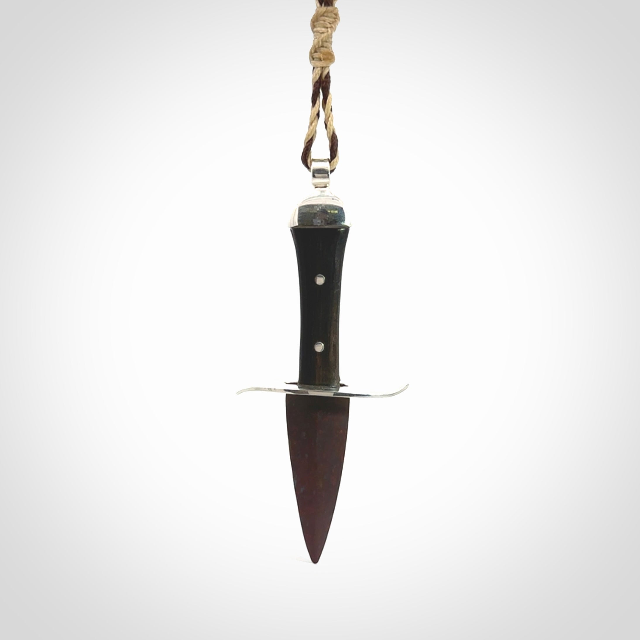 A striking hand carved knife pendant. These are carved with a Red Jasper Stone head and a hardwood handle. The cords are hand plaited in our waxed polyester which is robust, strong and durable. We ship these worldwide with express courier.