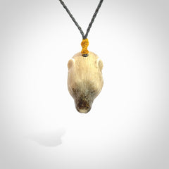 Hand carved deer antler polar bear pendant. Hand carved by NZ Pacific. Free postage worldwide. Hand made polar bear head necklace from deer antler. Animal themed necklace for men and women.