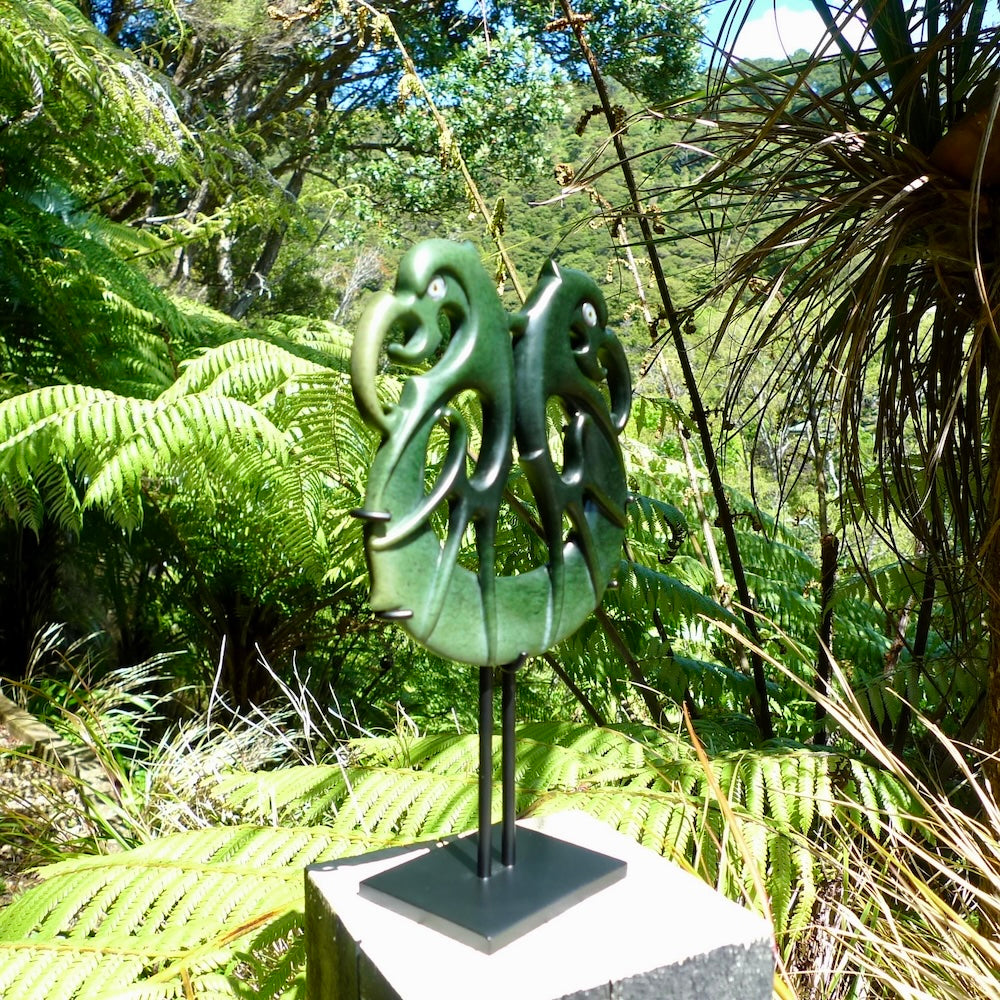 A hand carved New Zealand Jade Pekapeka sculpture with Paua shell eyes. A large sized hand made pekapeka, bat, sculpture by New Zealand artist Kerry Thompson. One off work of art to display.